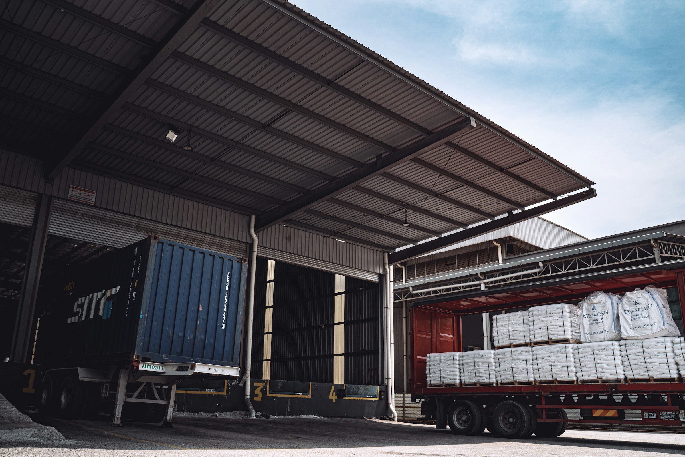 Semi truck being loaded at a loading bay