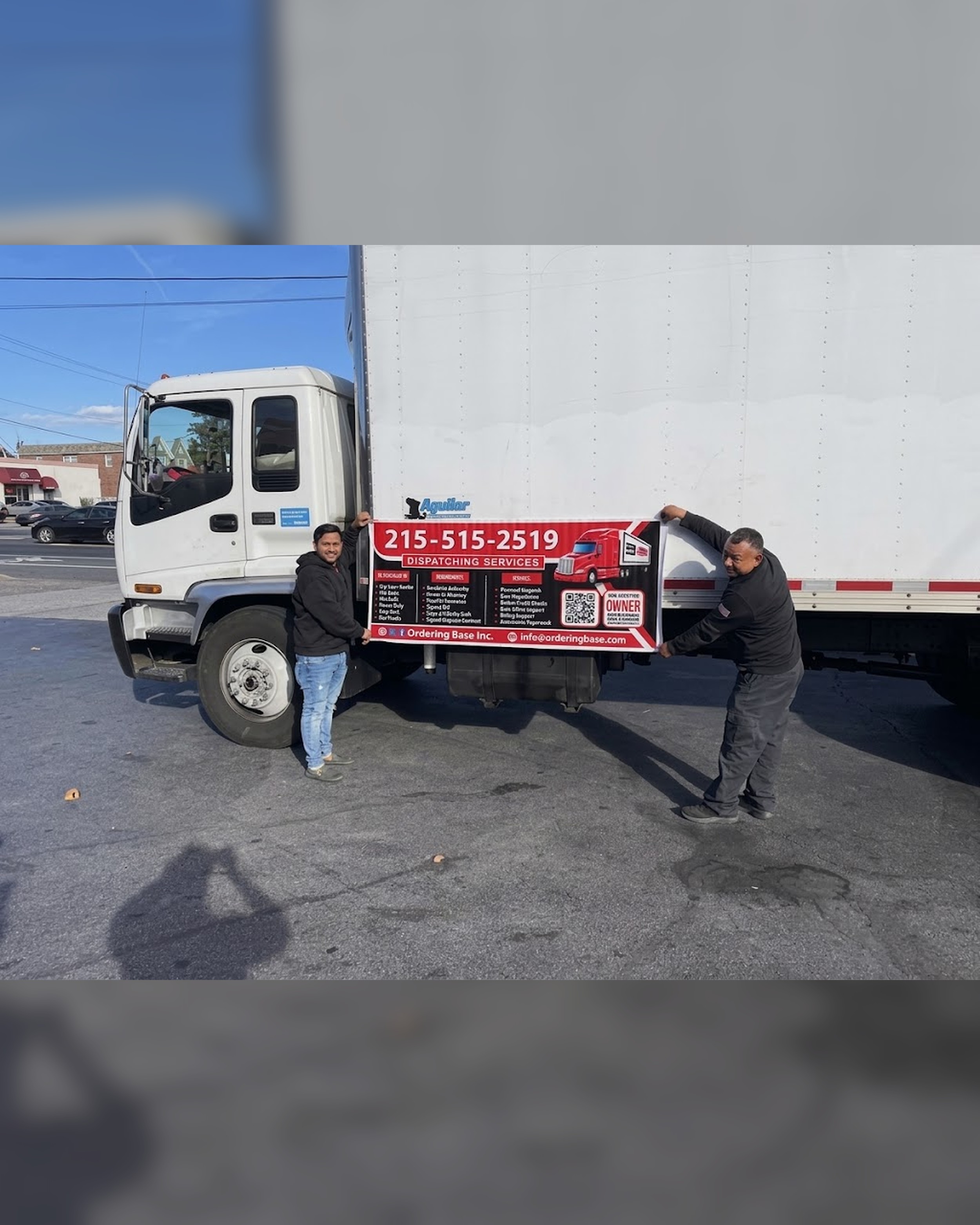 Ordering Base Inc. team with the Ordering Base dispatching banner on a box truck, both partners shown