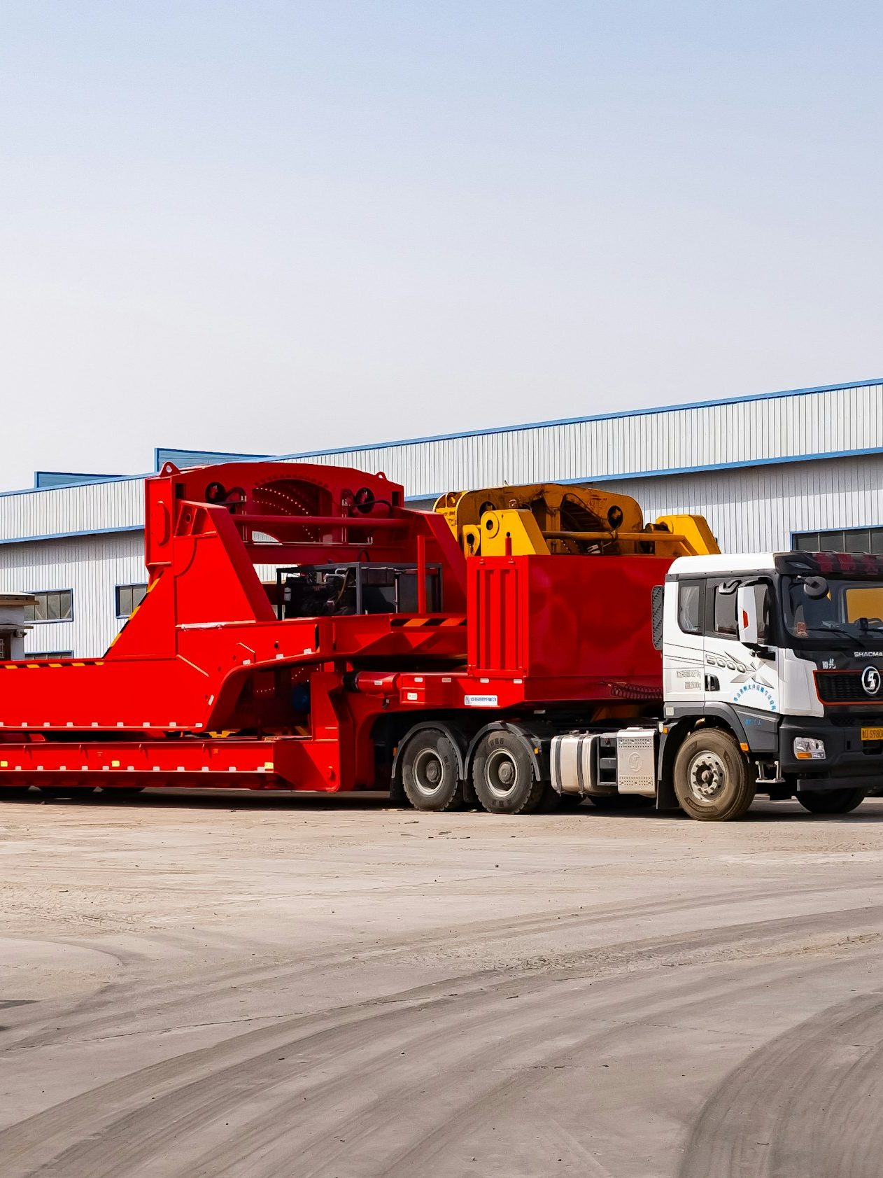 Heavy-duty trucks and trailers in a yard