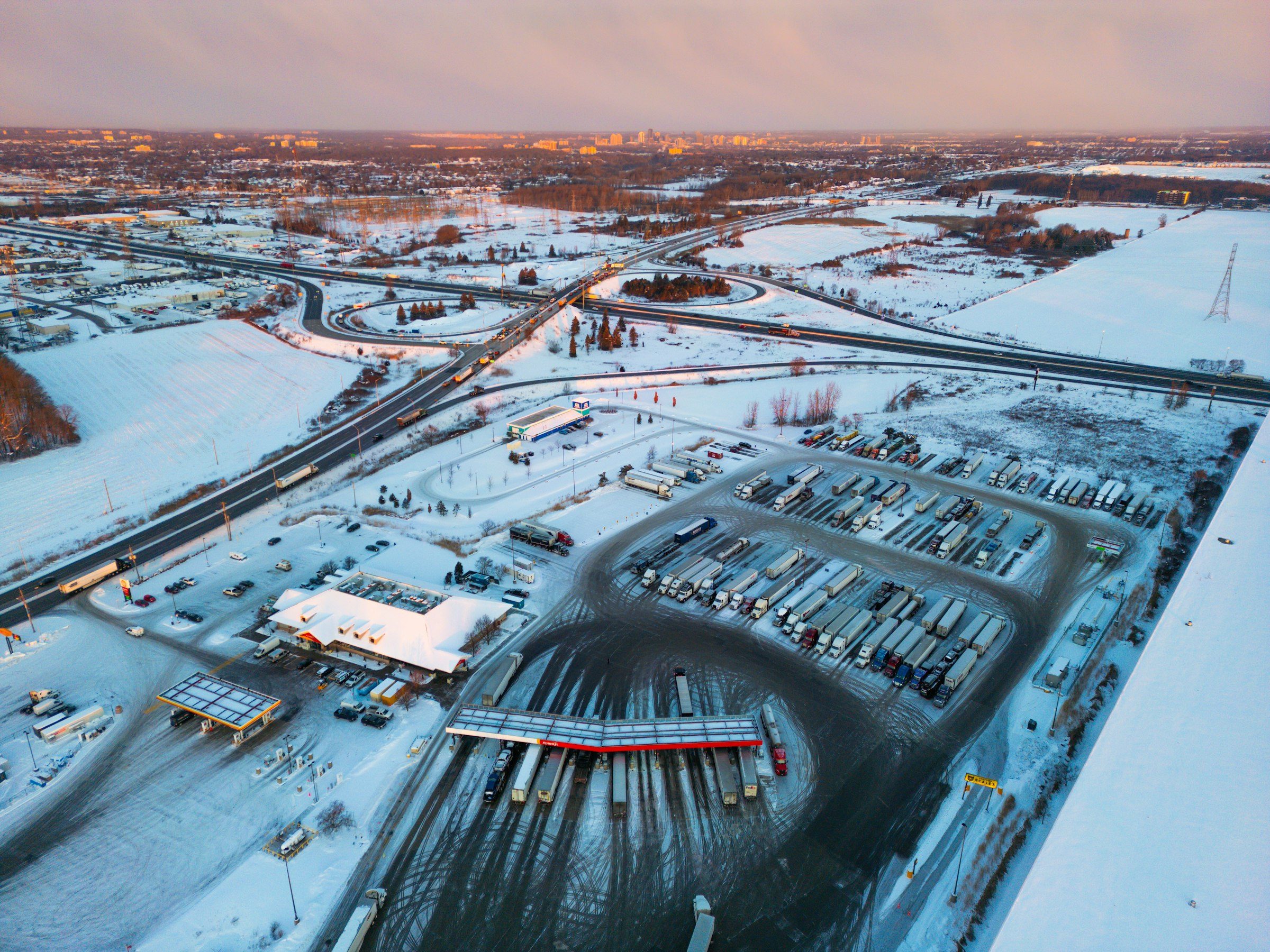 Aerial view of a truck stop next to the interstate