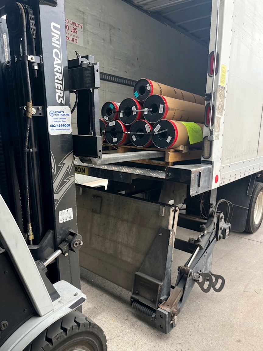 Tarped flatbed load locked for transit