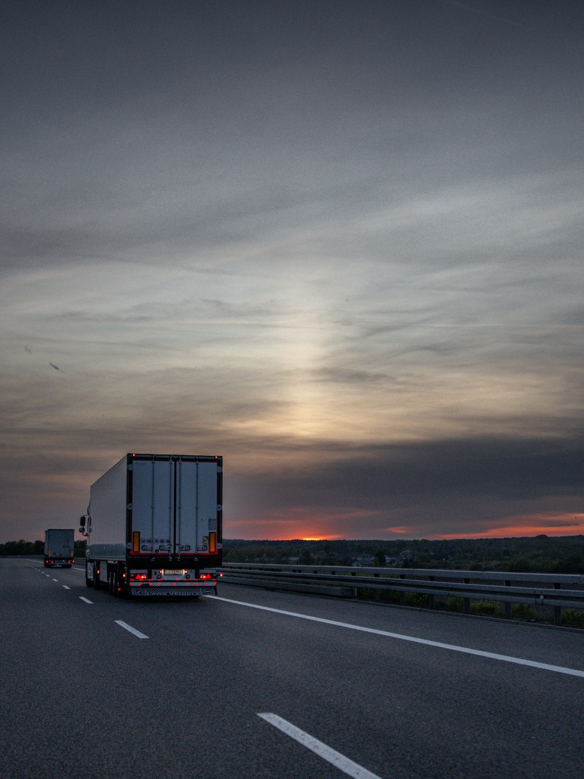 Semi truck on the highway at sunset